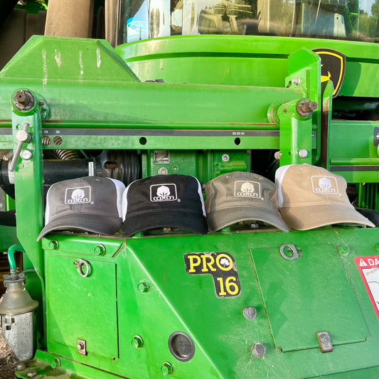 Mesh back hats in assorted colors with adjustable fit and embroidered Seal of Cotton logo